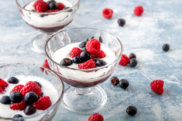 Refreshing strawberry soup in a crystal bowl over a blue background