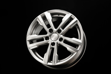 grey silver alloy wheel on black background