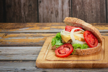 Homemade sandwiches on the board with copy space.