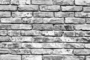 Texture of a brick wall with cracks and scratches which can be used as a background