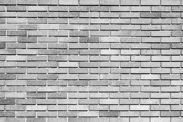 Texture of a brick wall with cracks and scratches which can be used as a background