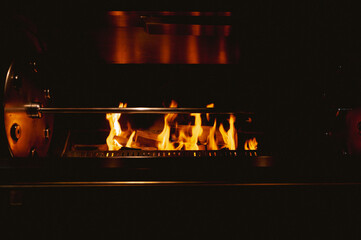 Restaurant automatic fireplace for meat cooking (high ISO image)