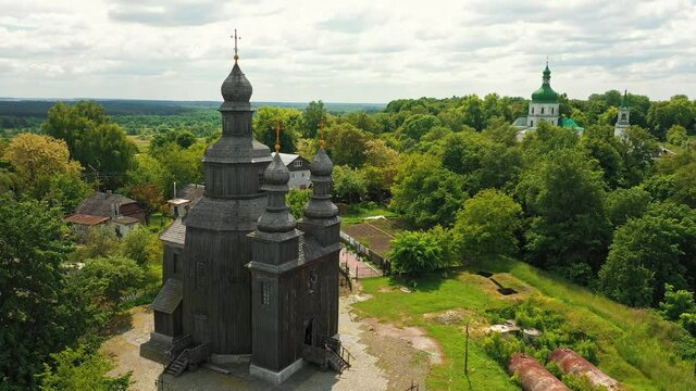 Rural landscape flying around the old wooden church.