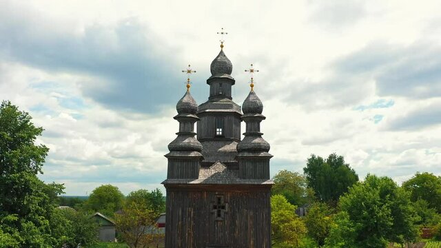 Rural landscape flying around the old wooden church.