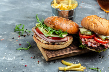 burger with ham, cheese, bacon, salad and vegetables. Big burger, american fast food. banner, menu, recipe place for text