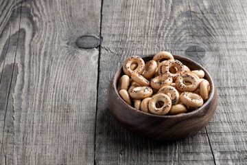 Bowl full of small traditional russian bread rings on wooden table