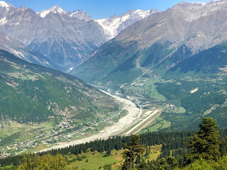 Georgia, Svaneti in September: view over the city in the mountains with small airport