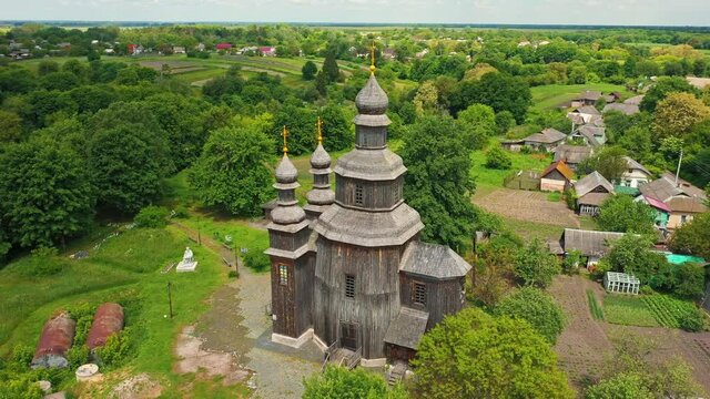 Rural landscape flying around the old wooden church.