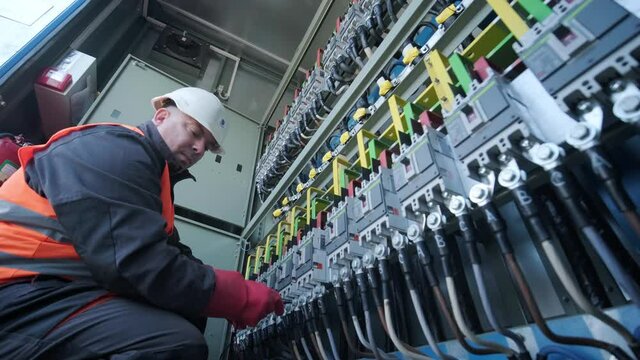 Checking the operating voltage levels of the solar panel switchgear compartment