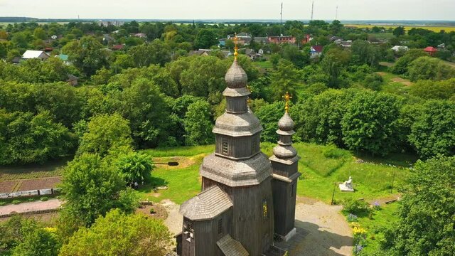 Rural landscape flying around the old wooden church.