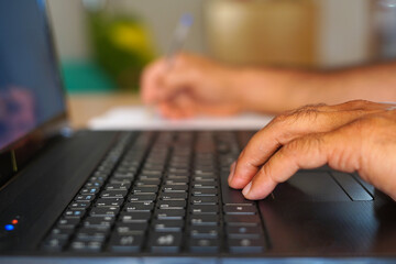 Closeup view of businessman holding modern smartphone on hands, Man working at sunny office at workplace