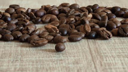 Coffee beans on wooden background 