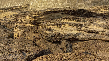 Sunny beige textured sandstone rocks along the French Opal coast along north sea