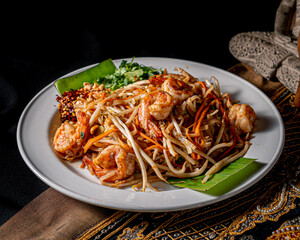 Delicious shrimp pad thai served on a white plate
