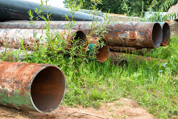 Old rusty water pipes of the city. Water supply system repair.