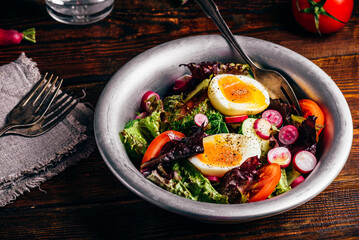 Fresh spring salad with homegrown vegetables and boiled eggs