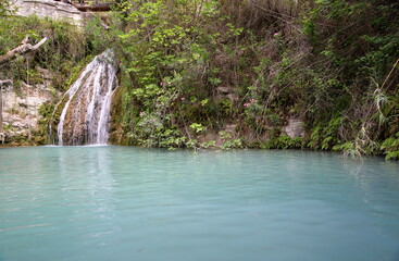 Obraz premium waterfall in the forest, Oasis in the mountains in Cyprus, called Adonis Bath 