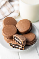 Biscuits with chocolate icing on plate.
