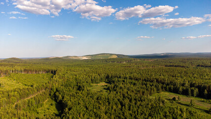 Fototapeta premium hill and clouds soaring in the sky