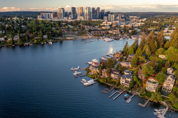 Aerial of Bellevue from a Bay with Boats at Sunset where you can see the City's Reflection