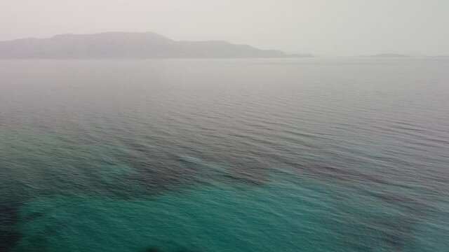 aerial shot kalamos island beach and yacht, lefkada, greece