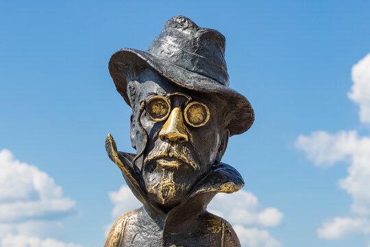 Portrait of Chekhov. Monument to the Russian writer A.P. Chekhov against the blue sky