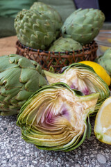 Obraz premium Fresh ripe green artichokes heads ready to cook