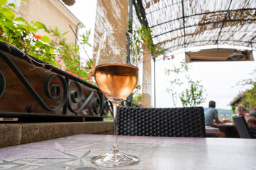 Summer on French Riviera Cote d'Azur, drinking cold rose  wine from Cotes de Provence on outdoor terrase in cafe