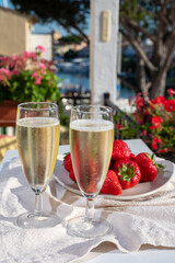 Summer party, pouring of French champagne sparkling wine in glasses in yacht harbour of Port Grimaud near Saint-Tropez, French Riviera vacation, France