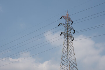 lamppost in front of blue cloudy sky