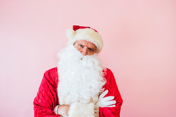 Man dressed as Santa Claus looking seriously at camera angry