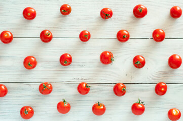 fresh cherry tomatoes scattered on a wooden deck. High quality photo