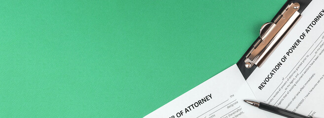 Banner revocation of power of attorney form. Office desk and clipboard with agreement. Top view and copy space photo