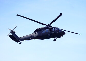 Fototapeta na wymiar Blackhawk helicopter flying over Arlington, Virginia.
