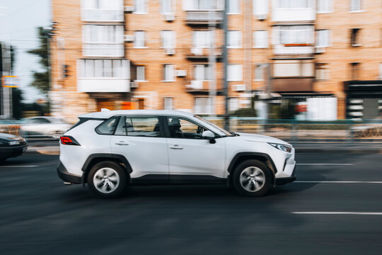 Ukraine, Kyiv - 16 July 2021: White Toyota RAV 4 car moving on the street. Editorial
