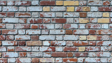 old brick wall of bricks of different colours as the background
