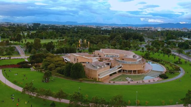 A modern building in the middle of a bogota park