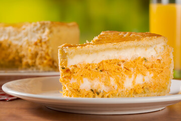 Close up orange juice and chicken pie slice with cheese on natural background