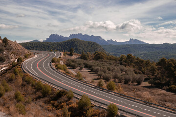 Curved road and Montserrat mountain