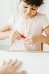 Six year preschooler girl with interest paint nails her moms with nail polish