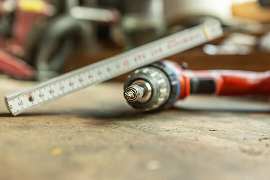 CLose-up of a cordless screwdriver on workbench