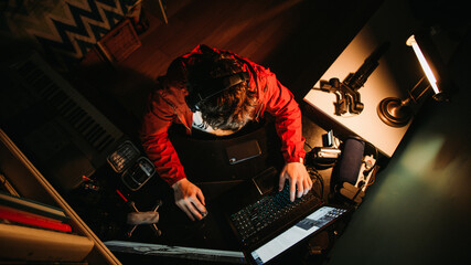 Content Creator Working Hard at his Home Office Work Desk