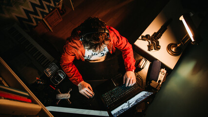 Man Working Late at Night Distracted on His Phone