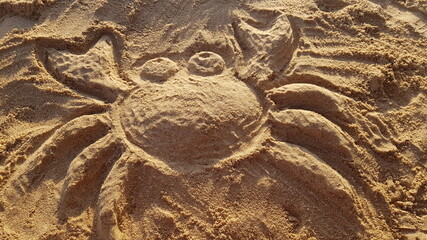 Simpatica Figure of a crab made in the sand