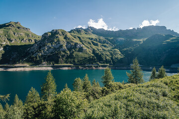 Fototapeta na wymiar View of the famous dam in Dolomites, Lago di Fedaia. Fedaia dam in Passo Fedaia, Dolomiti.