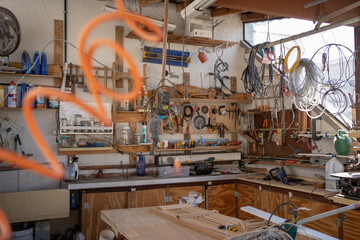 workshop with many tools hanging.