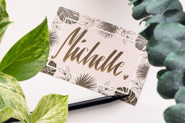 A handwritten greeting card with the name 