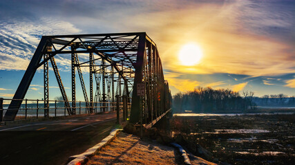 A train crossing a bridge over a body of water