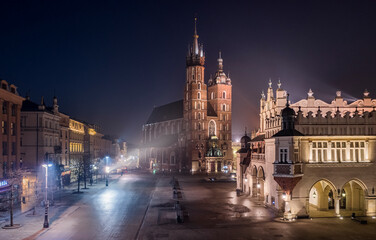 Fototapeta na wymiar Main Square in Krakow at night, view on Saint Mary's Basilica, Poland