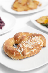 Fototapeta na wymiar vegan dairy-free organic german pretzel bread on white table